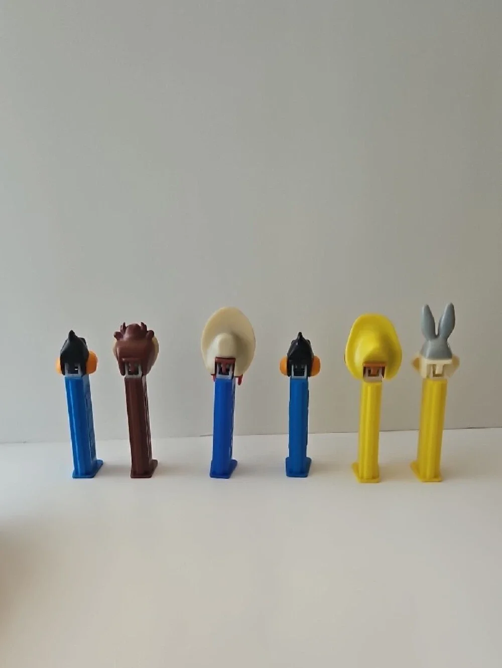 Vintage-Classic Cartoon Character PEZ Candy Dispensers - Blue, Yellow, Brown
